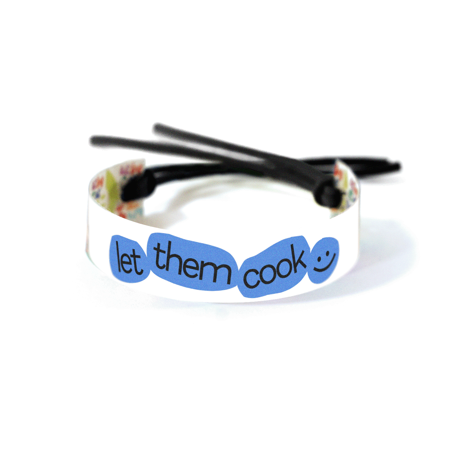 “Let Them Cook :)” text with abstract blue shapes circling the words on a white background.